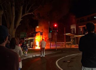 Locals Grab Fire Extinguishers As Bus Erupts In Flames Outside The Diddy