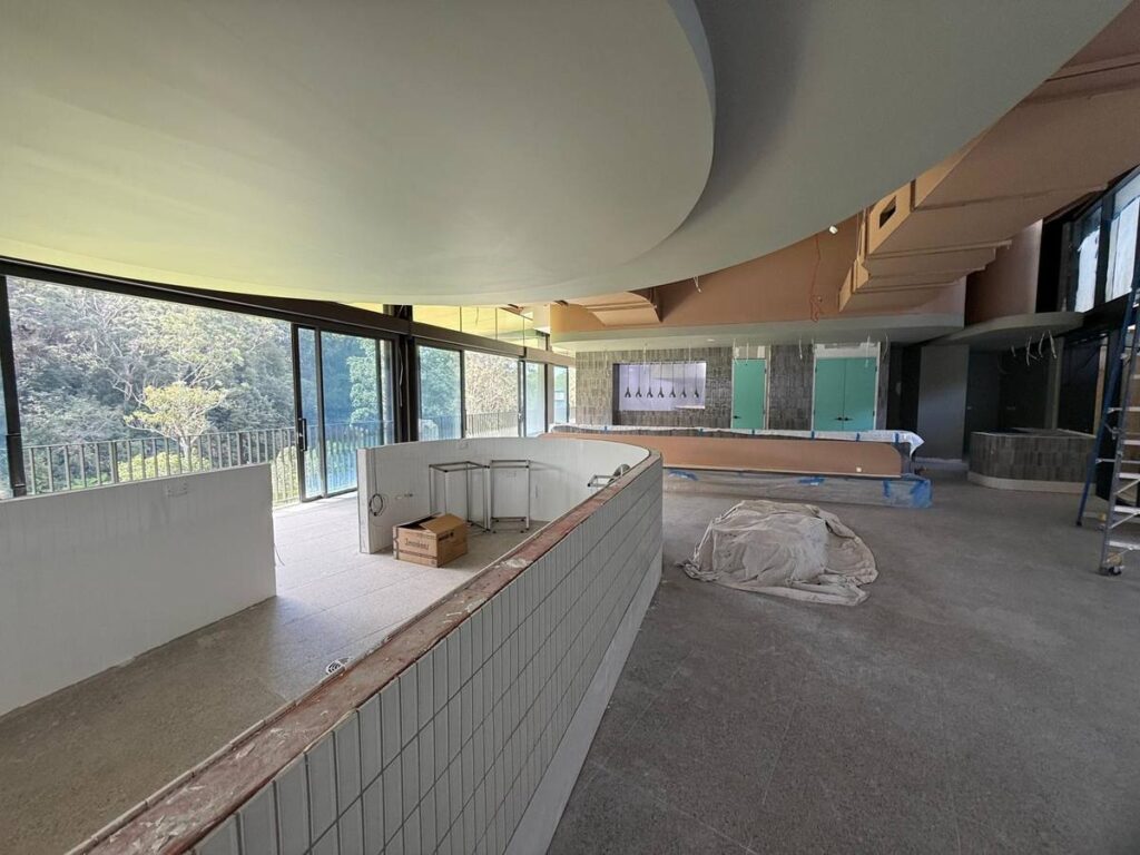 Curved tiled bar and bushland outlook at Galuwa Dining, Lane Cove