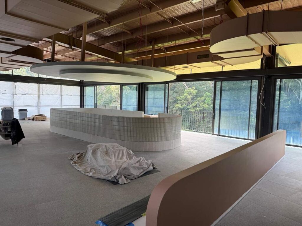 Interior of Galuwa Dining under construction at Lane Cove, with the curved central bar and windows onto the golf course