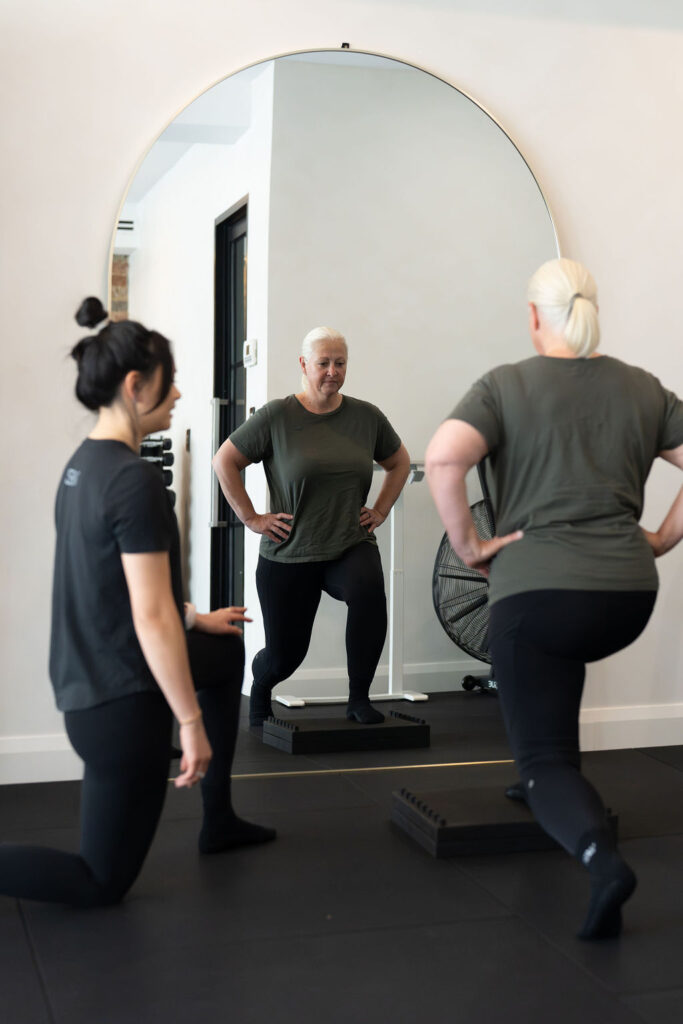 Women training together in a small group session at Strength By Women, Longueville