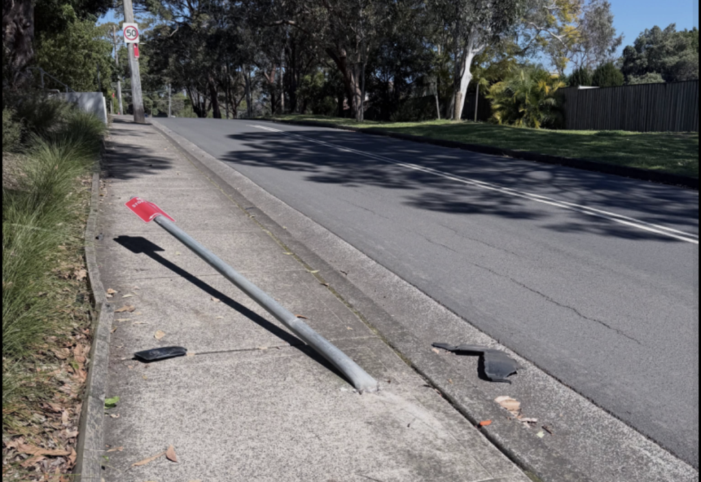 Fallen street sign blocking part of the Coxs Lane footpath in Lane Cove