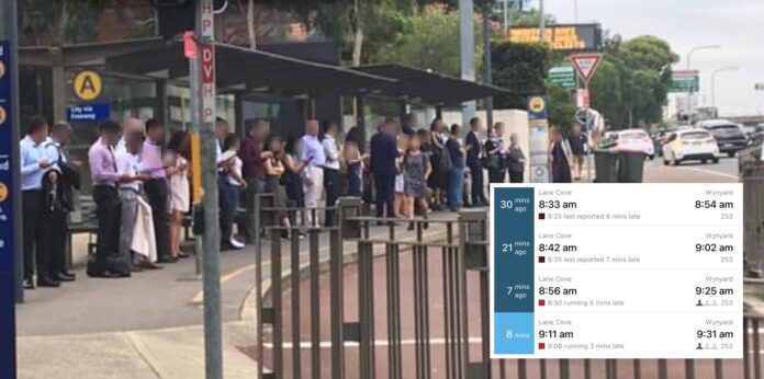 Commuters queuing at the Lane Cove bus stop on the Pacific Highway. An inset shows a real-time departure board with four consecutive route 253 services to Wynyard all running late.