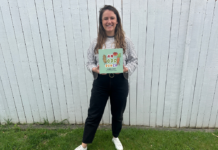 The author of the book holding her first published book