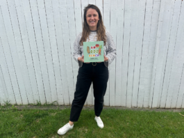 The author of the book holding her first published book