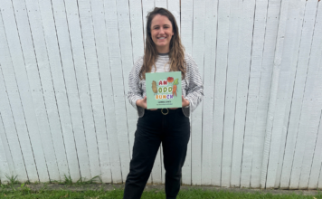 The author of the book holding her first published book