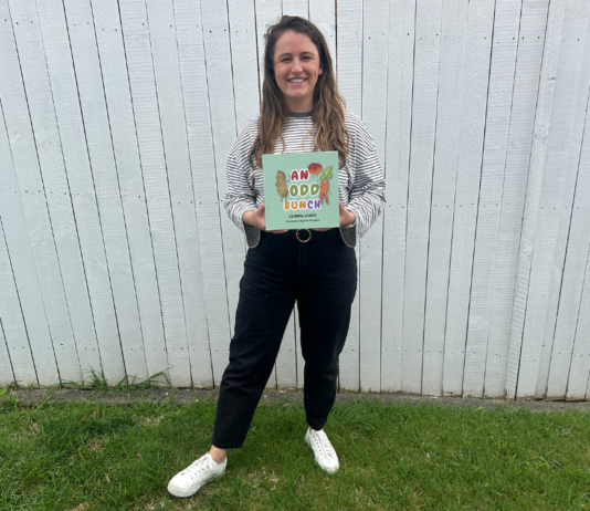 The author of the book holding her first published book