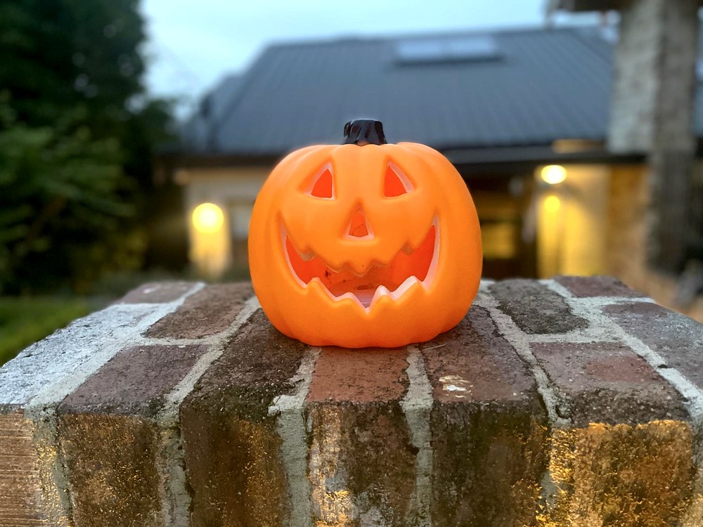 Pumpkin lantern on a brick wall