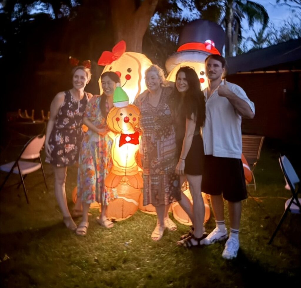 The In the Cove team at the 2025 ITC Christmas party in the backyard at 78 Austin Street, Lane Cove