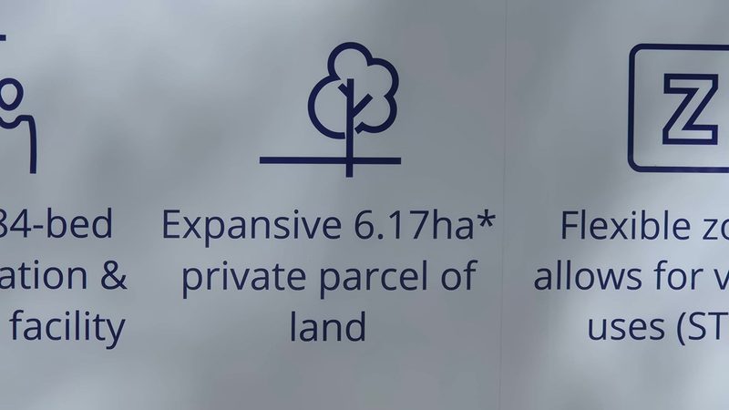 Close-up of a For Sale sign reading Expansive 6.17ha private parcel of land with a tree icon above